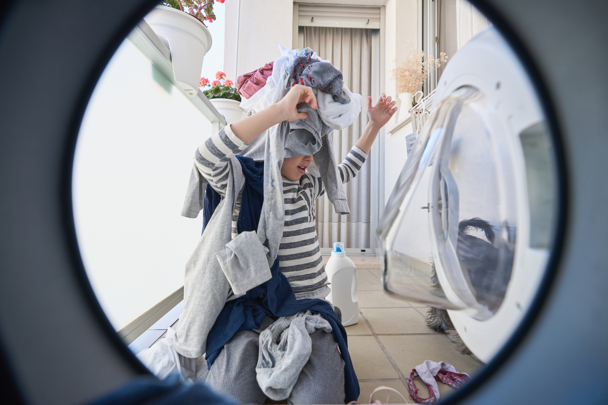 Child helping with laundry 